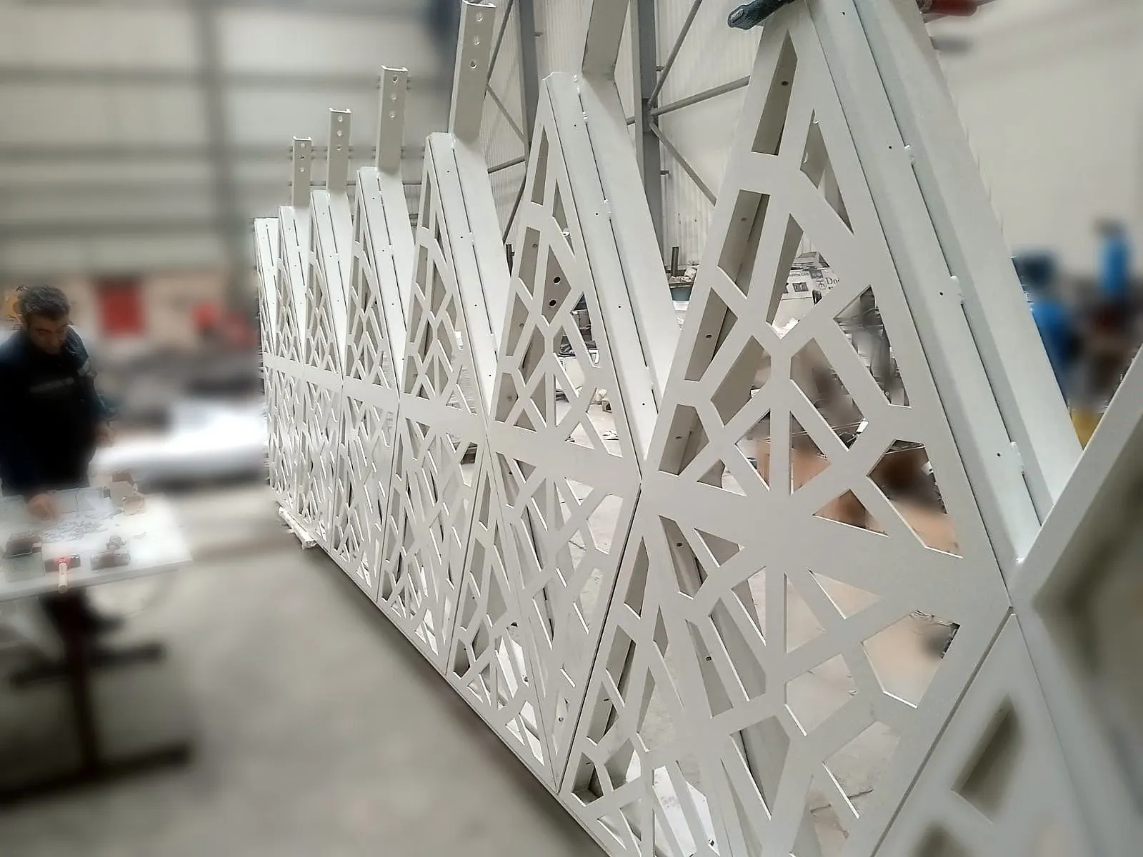 Laser-cut sunshade screen panels assembled at the NTK Metal plant