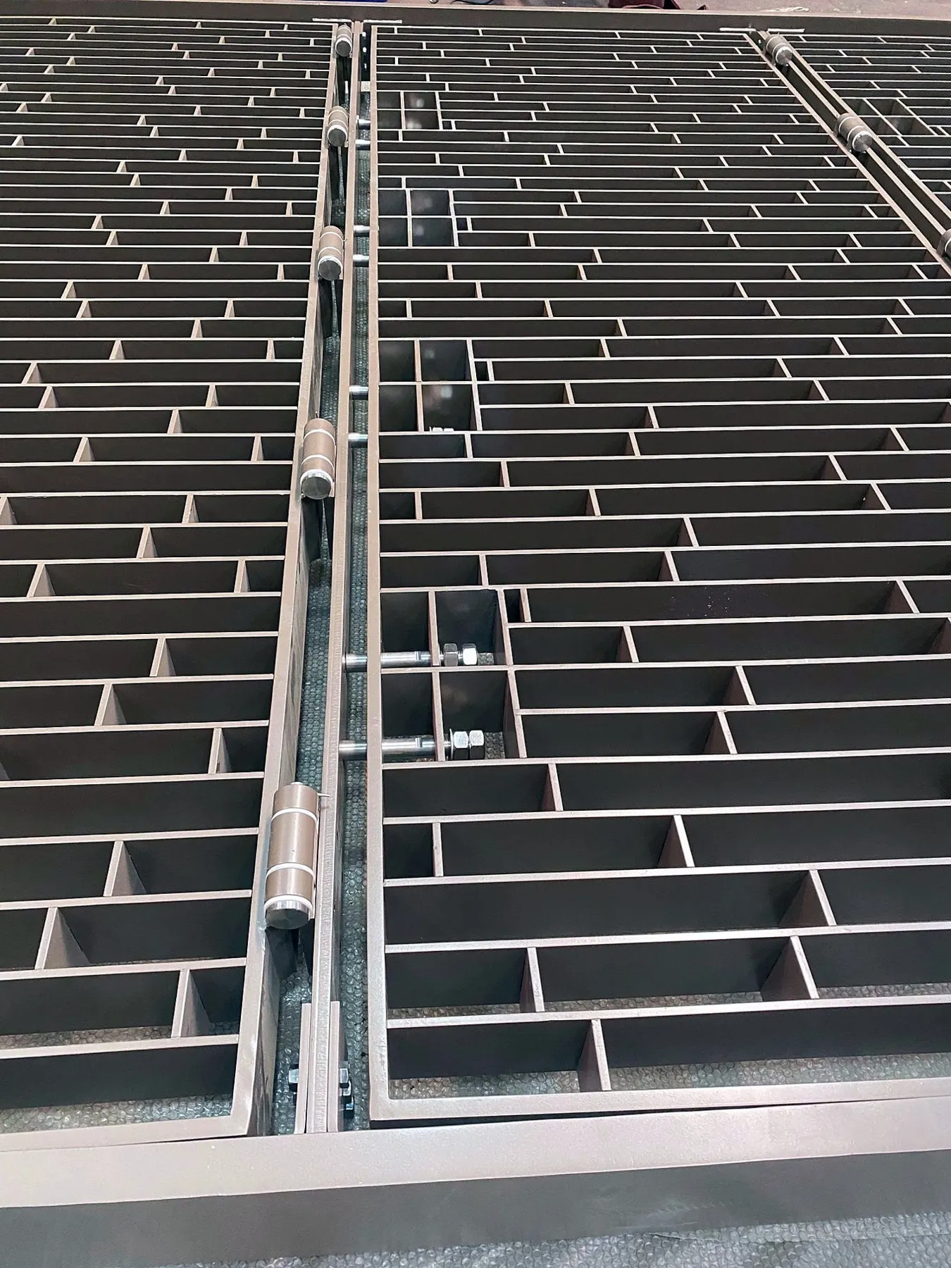 Operable window grille panels in the workshop